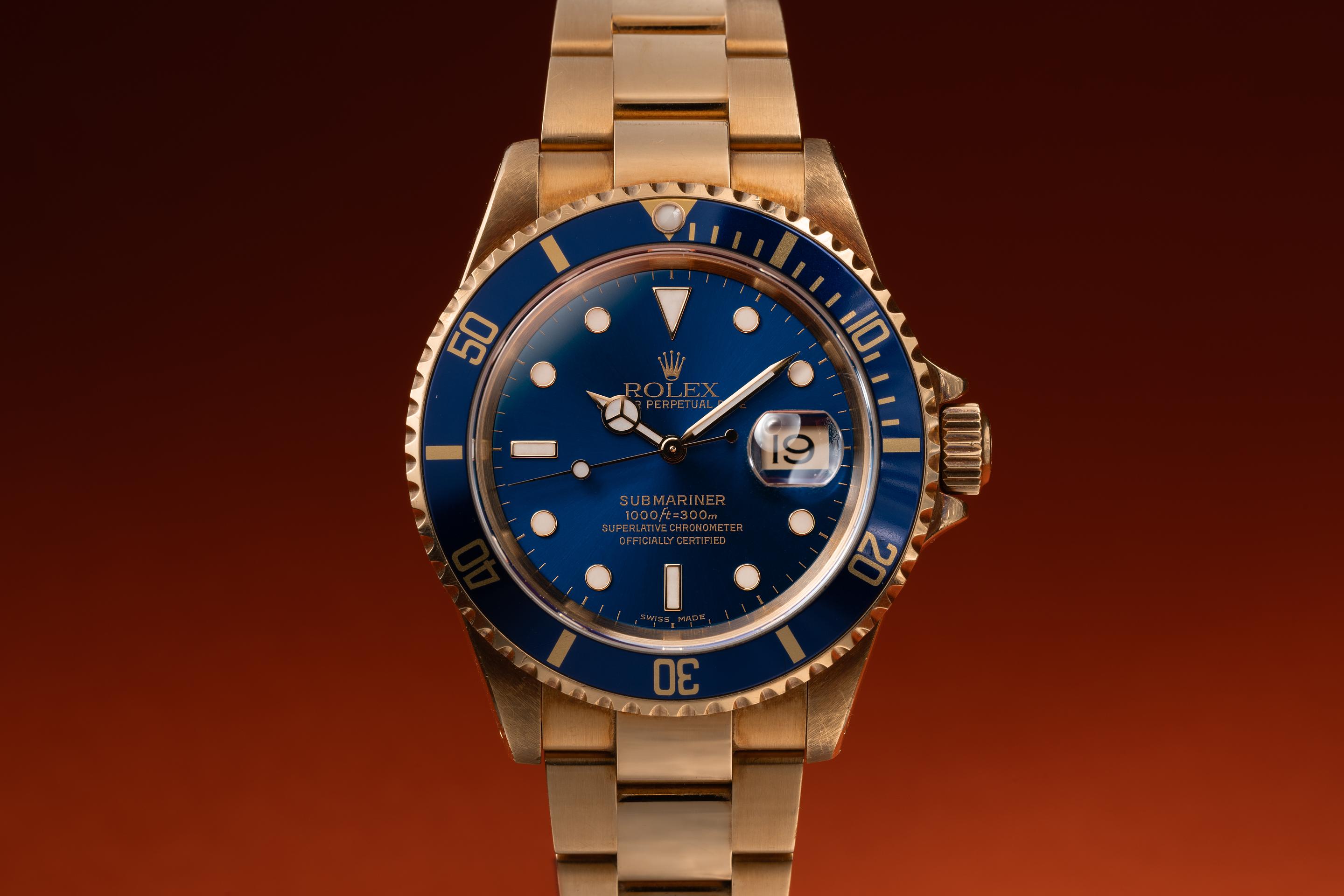 青い石のスカベラリング 2001 Rolex 18K YG Submariner 16118 Blue Dial with Box and Papers