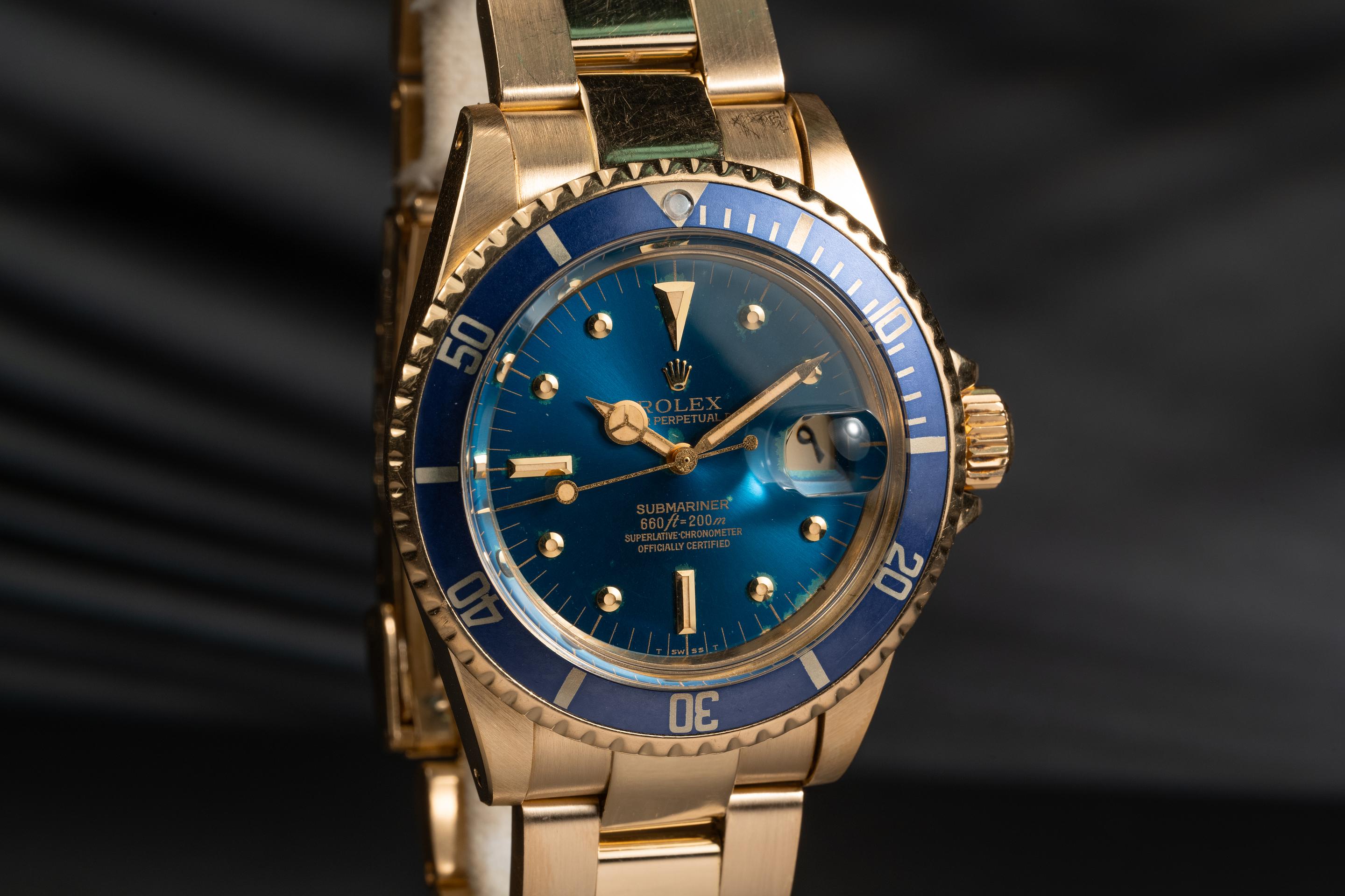 1976 Rolex 18K YG Submariner 1680 Blue Dial and Arabic Date Disk