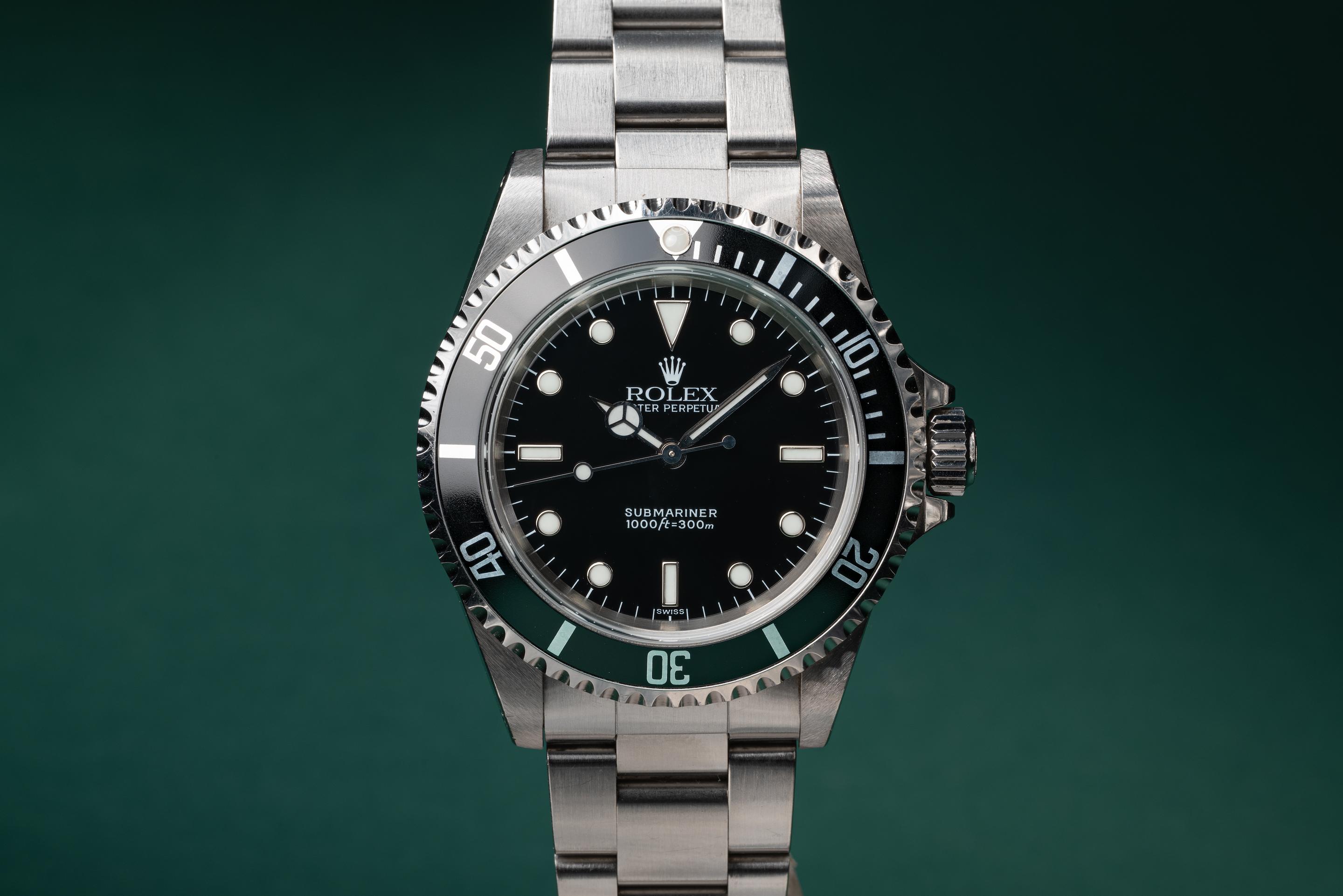 Rolex submariner 14060 swiss only outlet dial